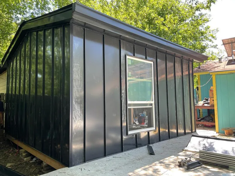 Black standing seam metal wall panels for Roof Inspection in Donaldsonville