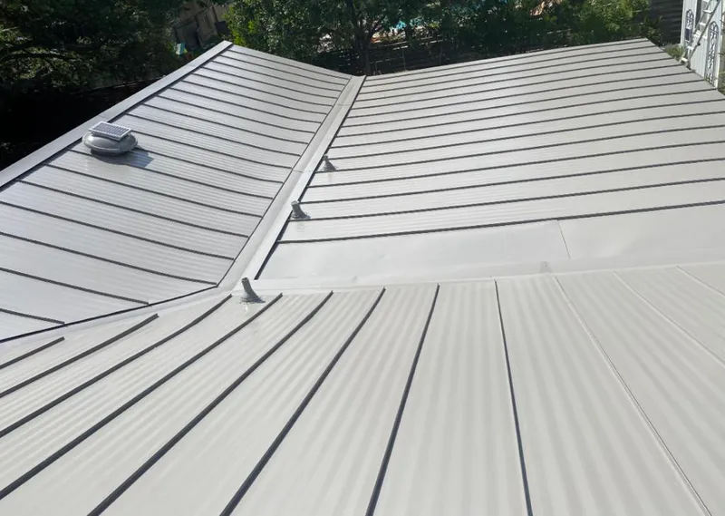 Solar attic fan installed on a metal roof for Roof Ventilation in Donaldsonville